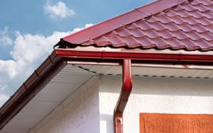 House roof, gutters and downspout on the corner of a house