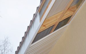 Close up on Soffit and Fascia Installation. Roofing Construction.