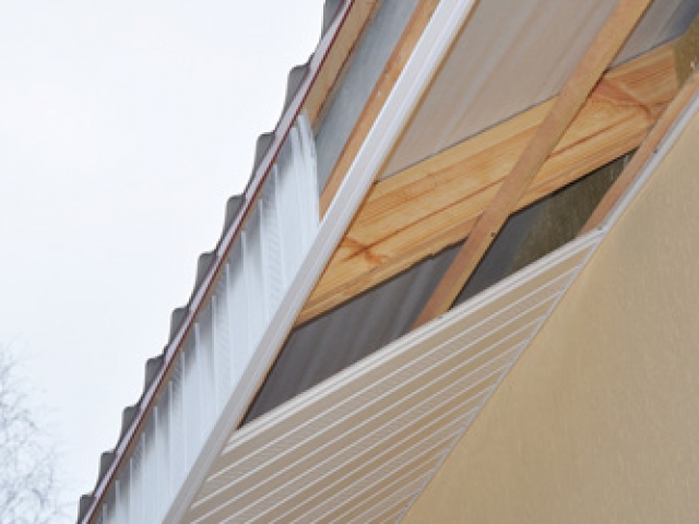 Close up on  Soffit and Fascia Installation. Roofing Construction.